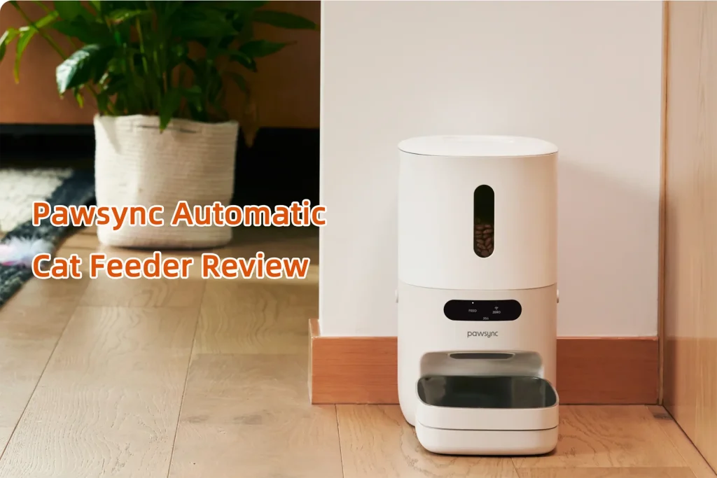 The Pawsync automatic cat feeder sitting on a wooden floor next to a potted plant, representing our 2026 review.